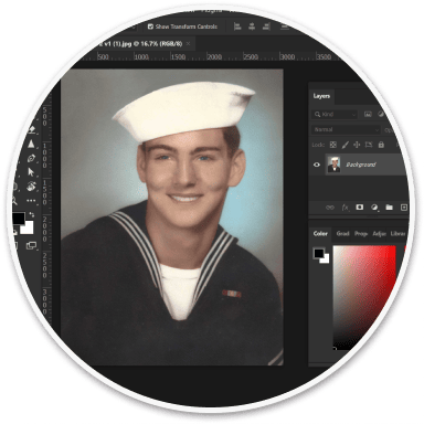 A designer digitally restoring and customizing the uploaded old photo